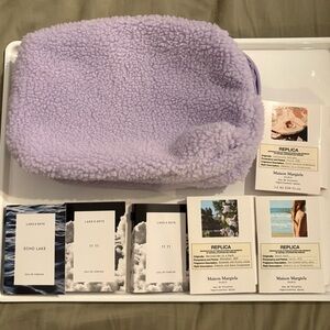 189- new makeup bag and #6 perfume samples